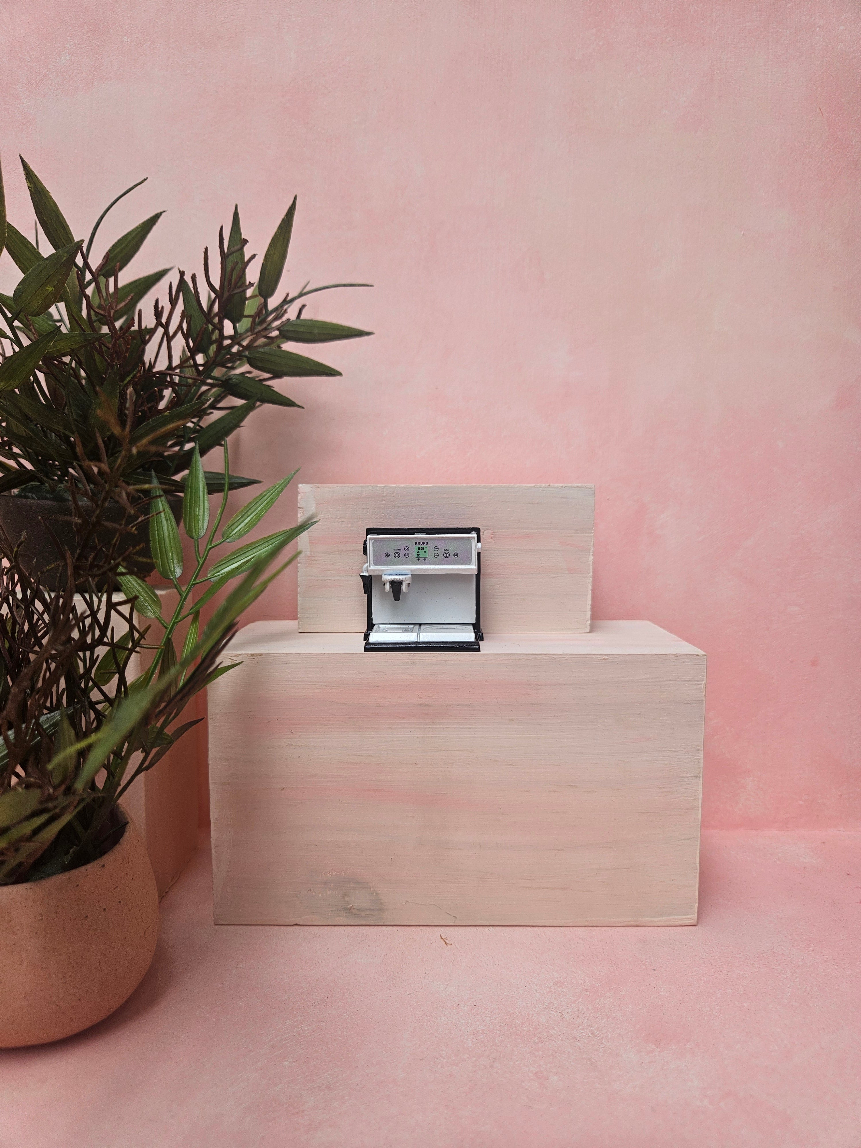 "Miniature coffee machine collectible for dollhouse café scene"