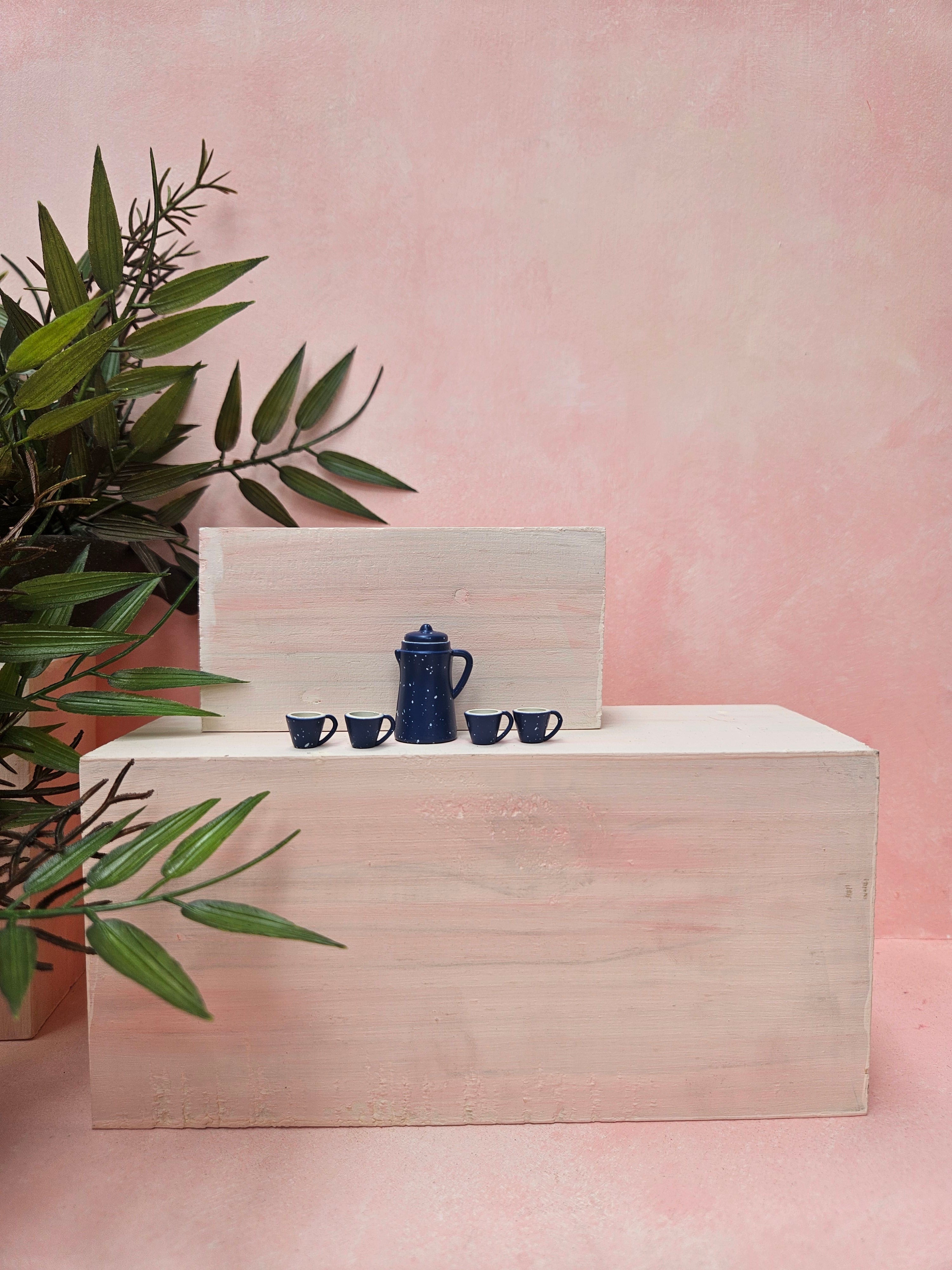 Miniature blue tea kettle and cup collectible gift with detailed tiny kitchenware design.