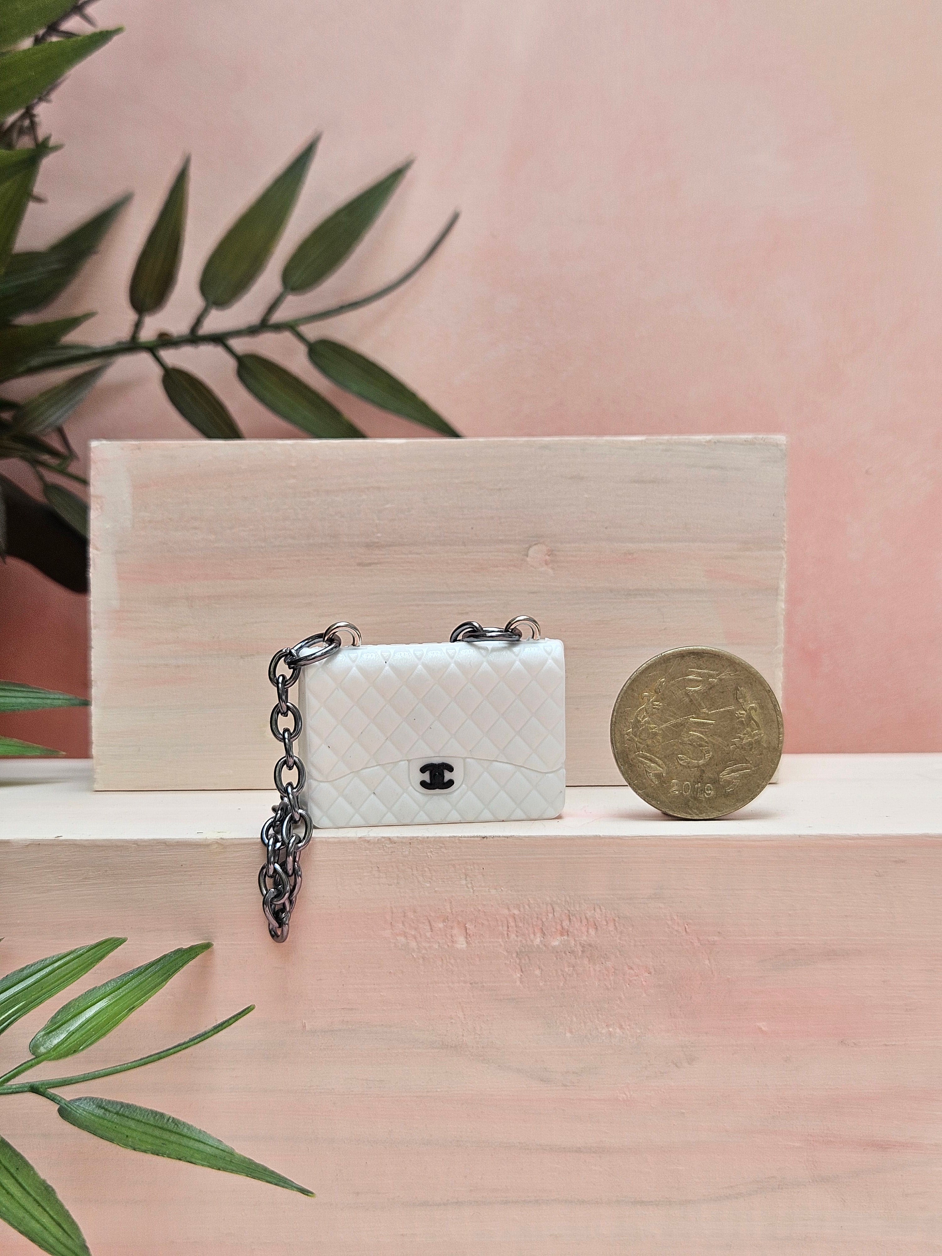 Discover a beautifully crafted Miniature Handbag with realistic detailing. Ideal for dollhouse accessories, collectibles, décor accents, or unique gifting.