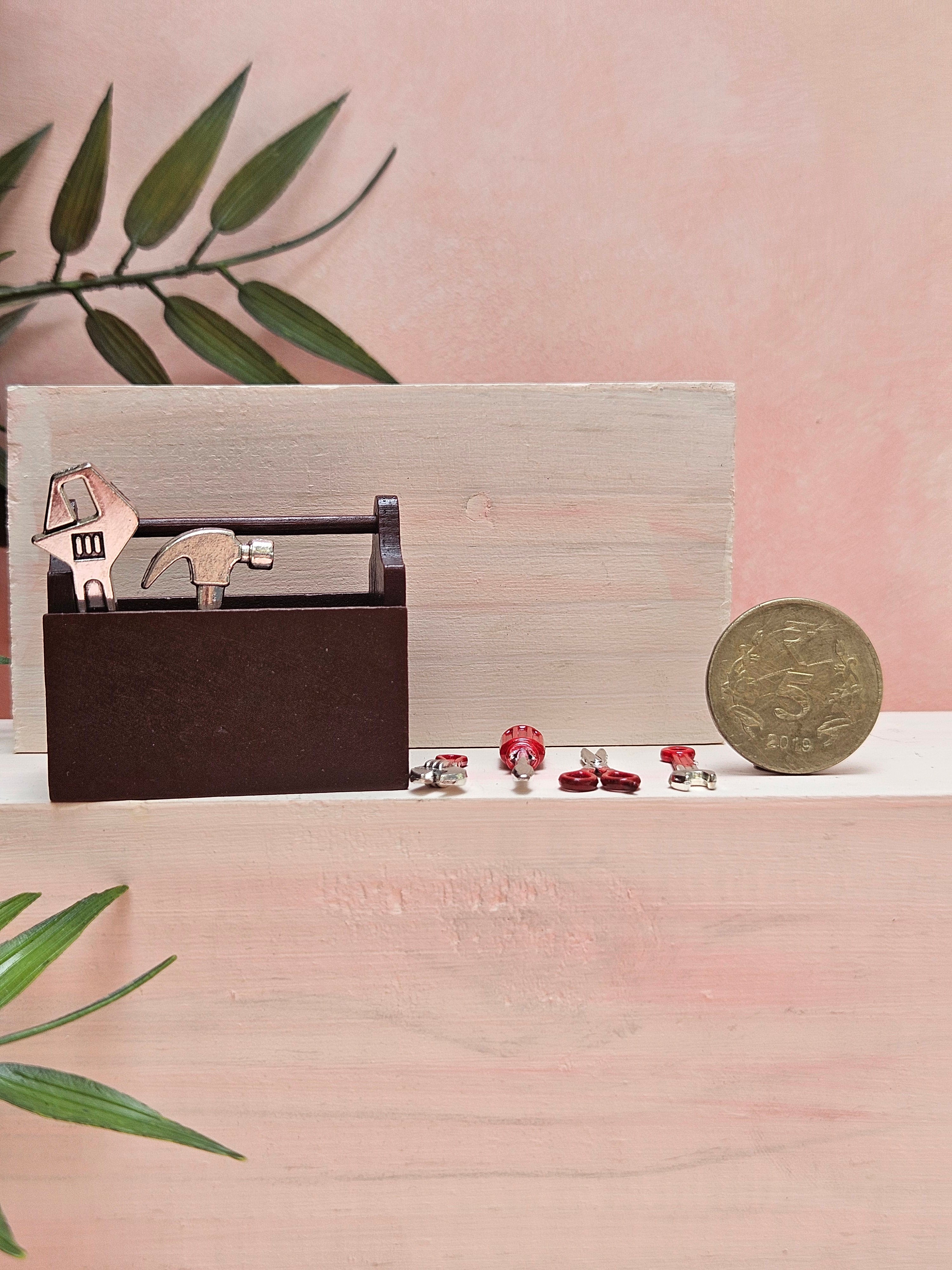 Miniature toolkit with realistic tiny tools for dollhouse décor and collectibles.