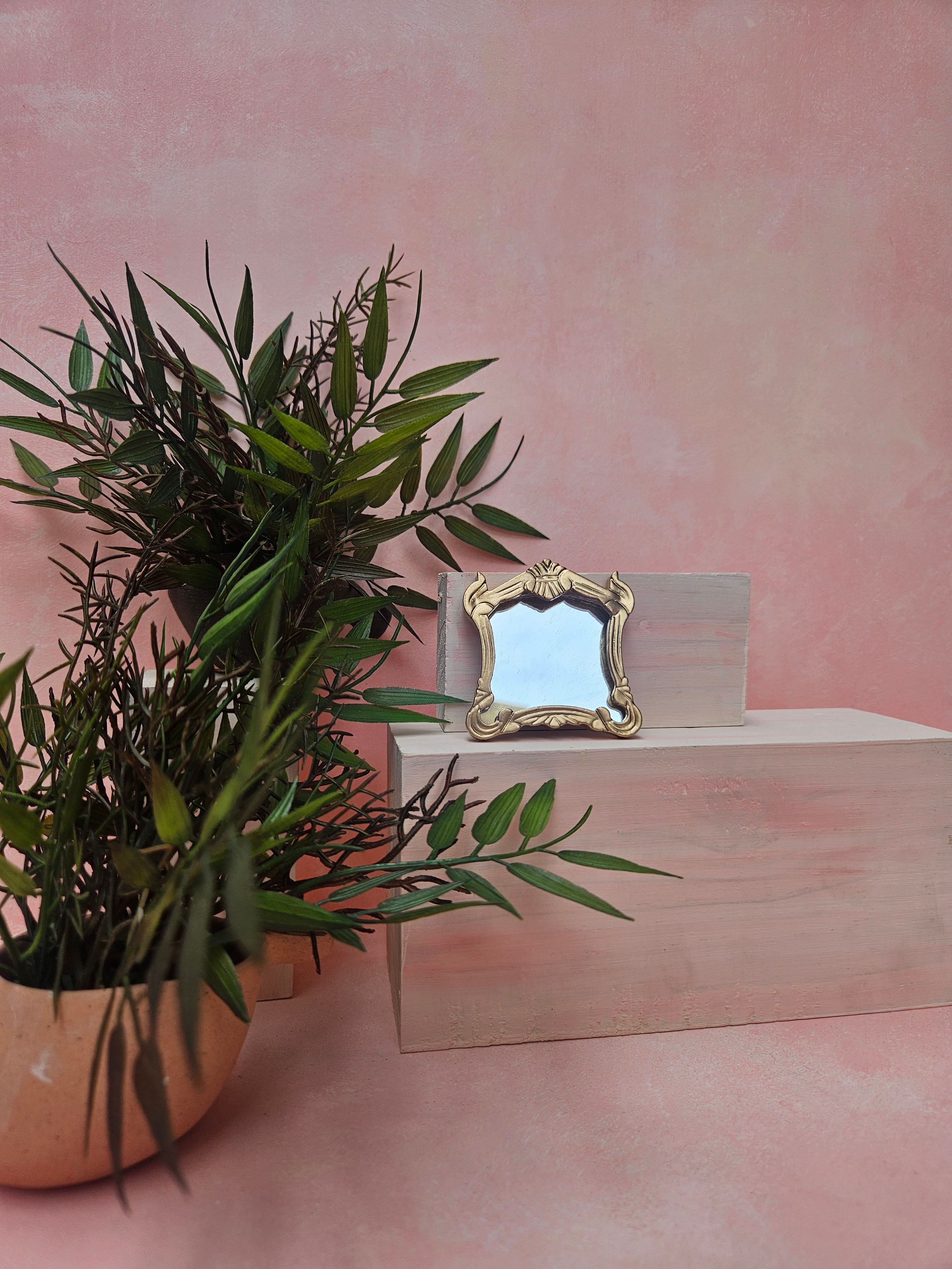 Miniature hanging mirror dollhouse accessory with realistic wall décor design.