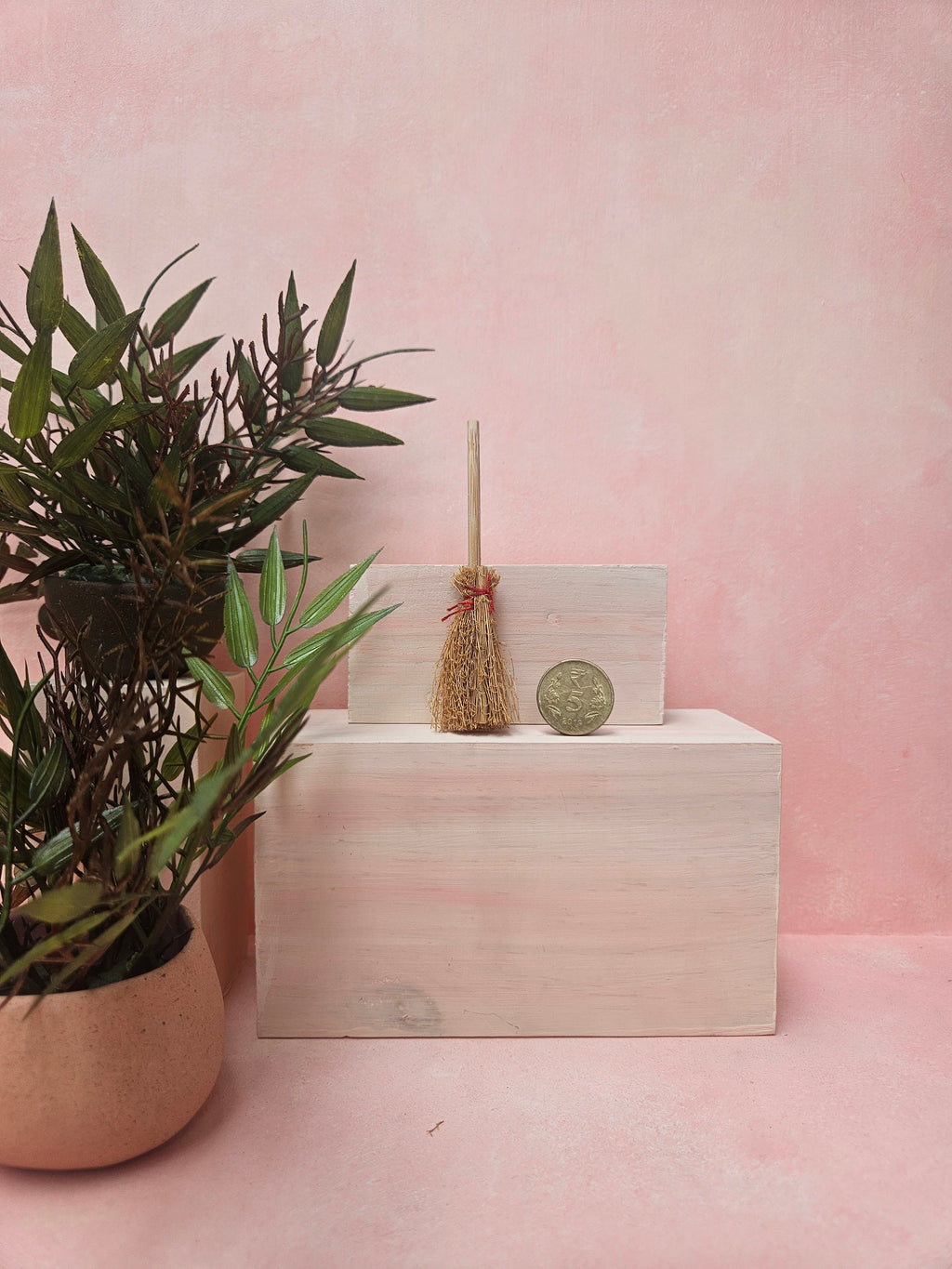"Miniature broom collectible for dollhouse cleaning scene"
