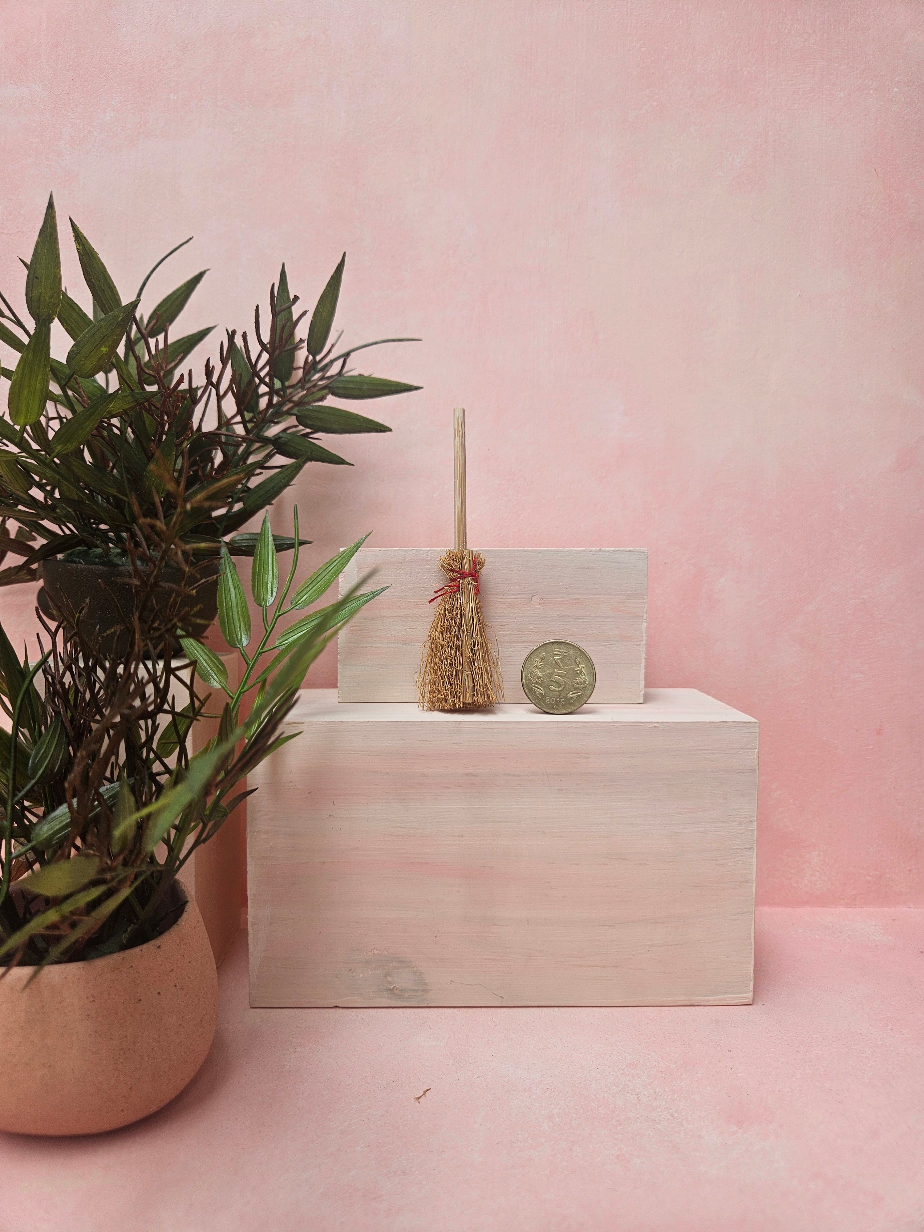 "Miniature broom collectible for dollhouse cleaning scene"