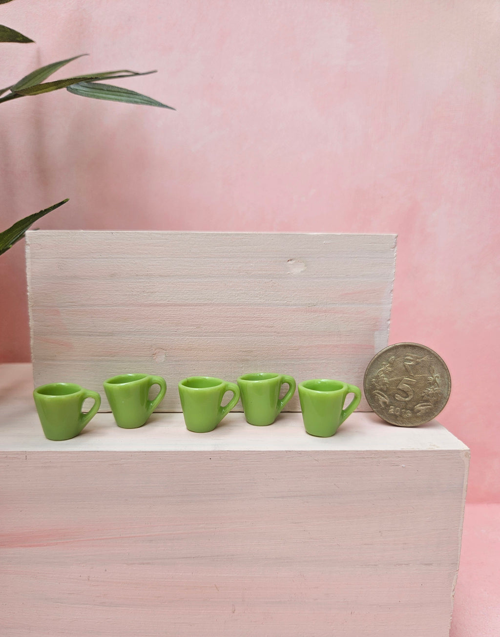 Miniature coffee and tea cups set collectible dollhouse accessory for hobbyists in India.
