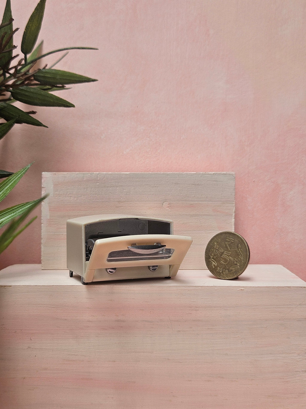 "Miniature oven collectible for dollhouse cooking scene"