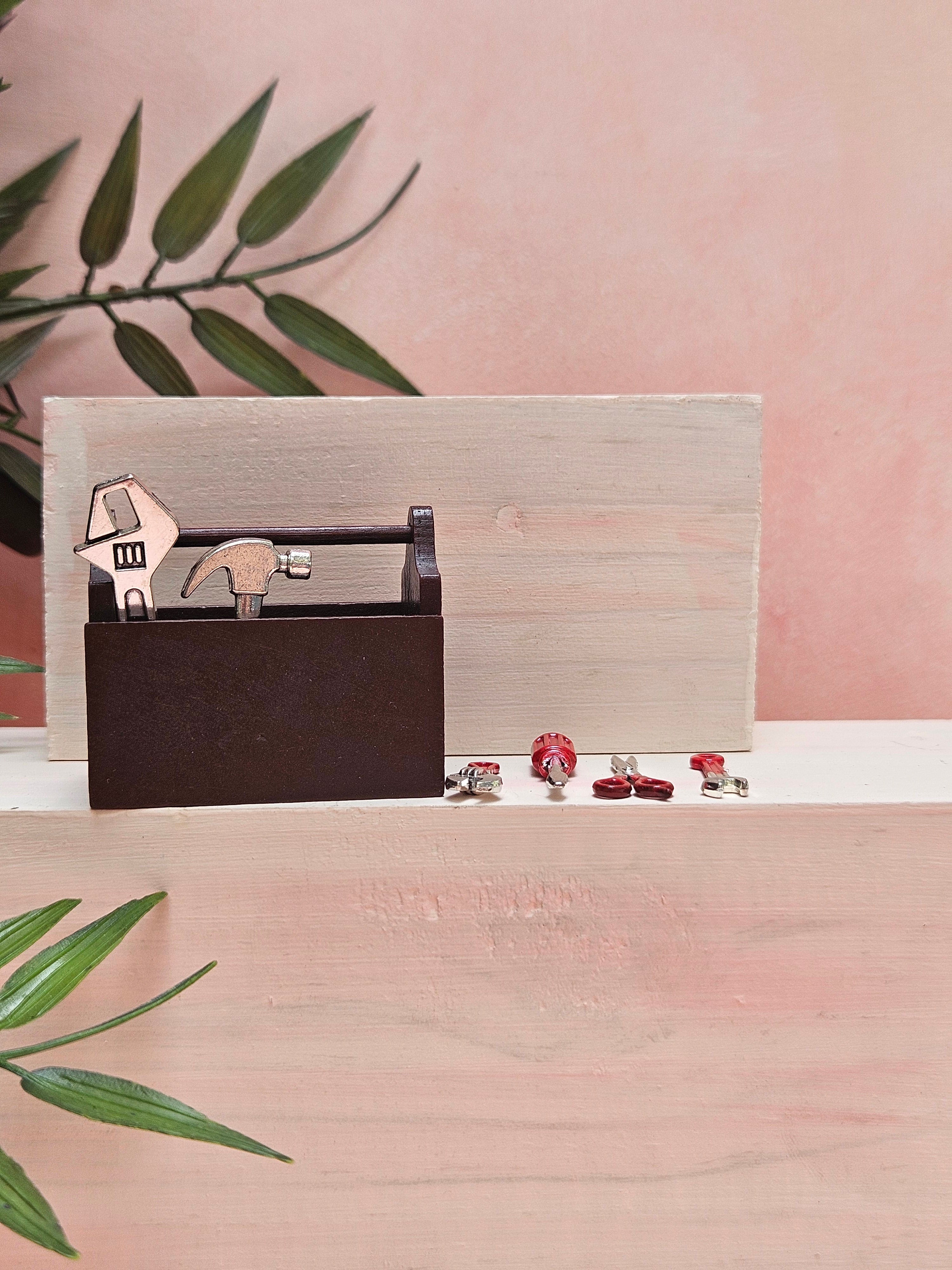 Miniature toolkit with realistic tiny tools for dollhouse décor and collectibles.