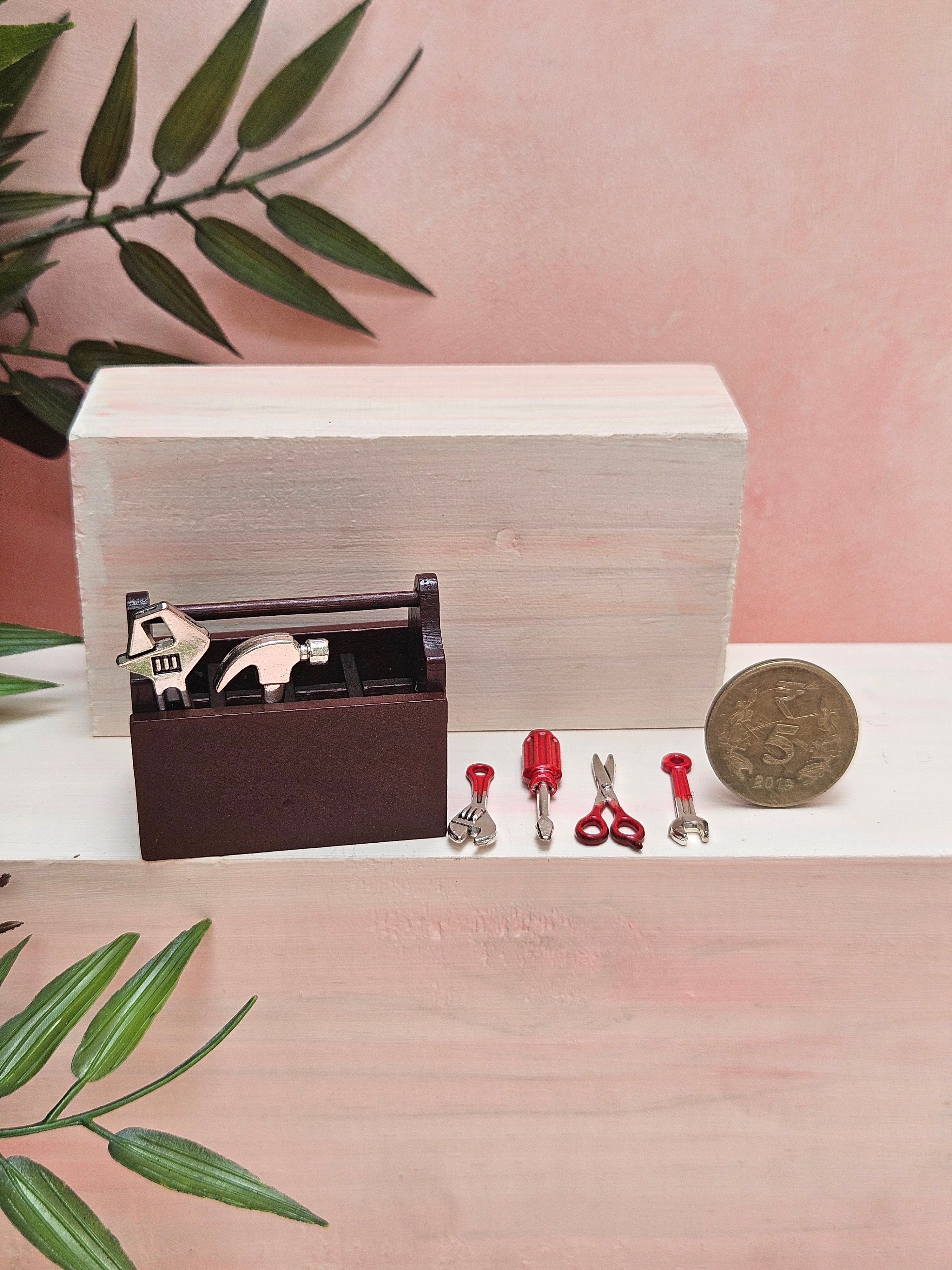 Miniature toolkit with realistic tiny tools for dollhouse décor and collectibles.