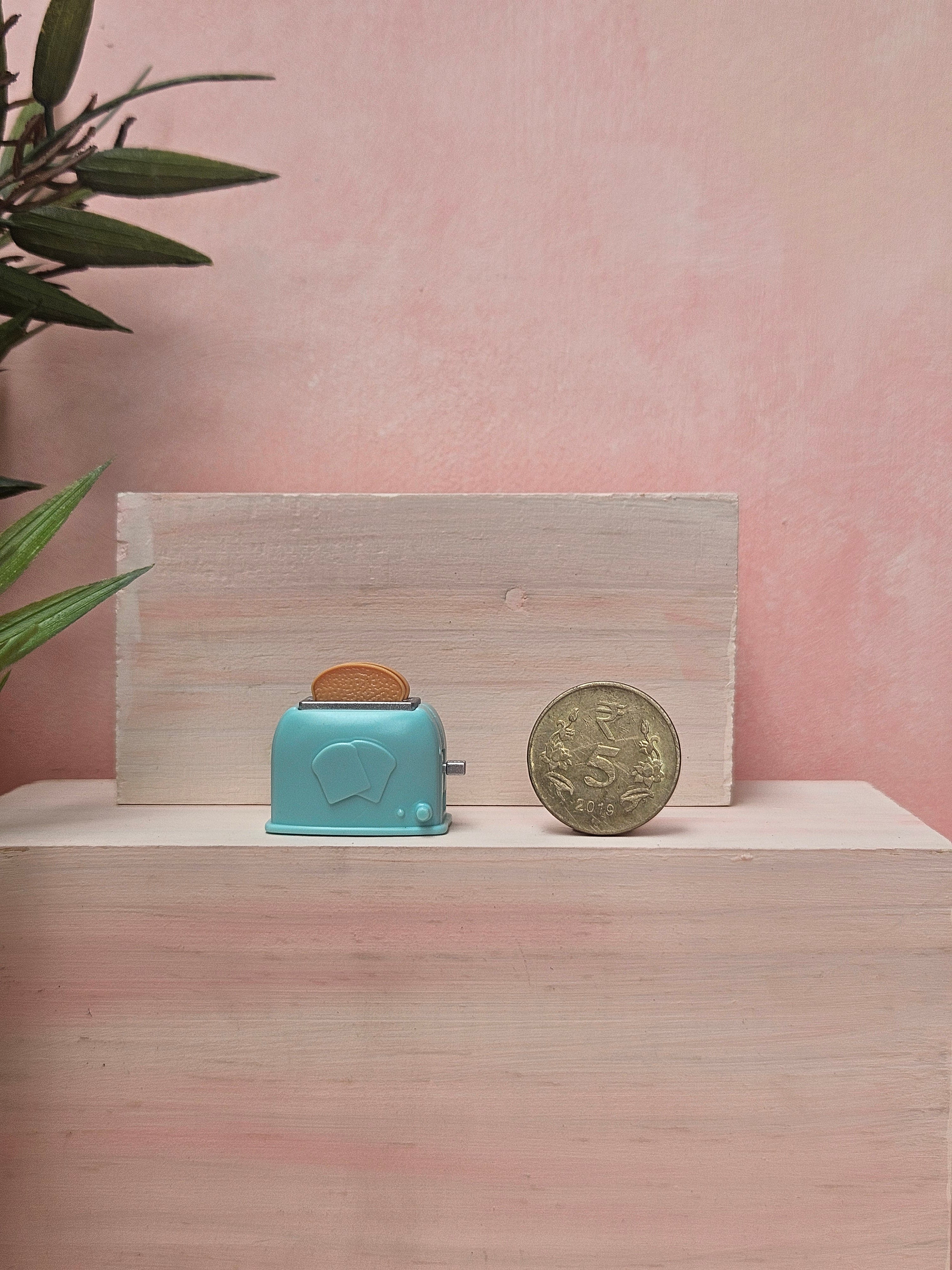 "Miniature toaster collectible for dollhouse breakfast scene"